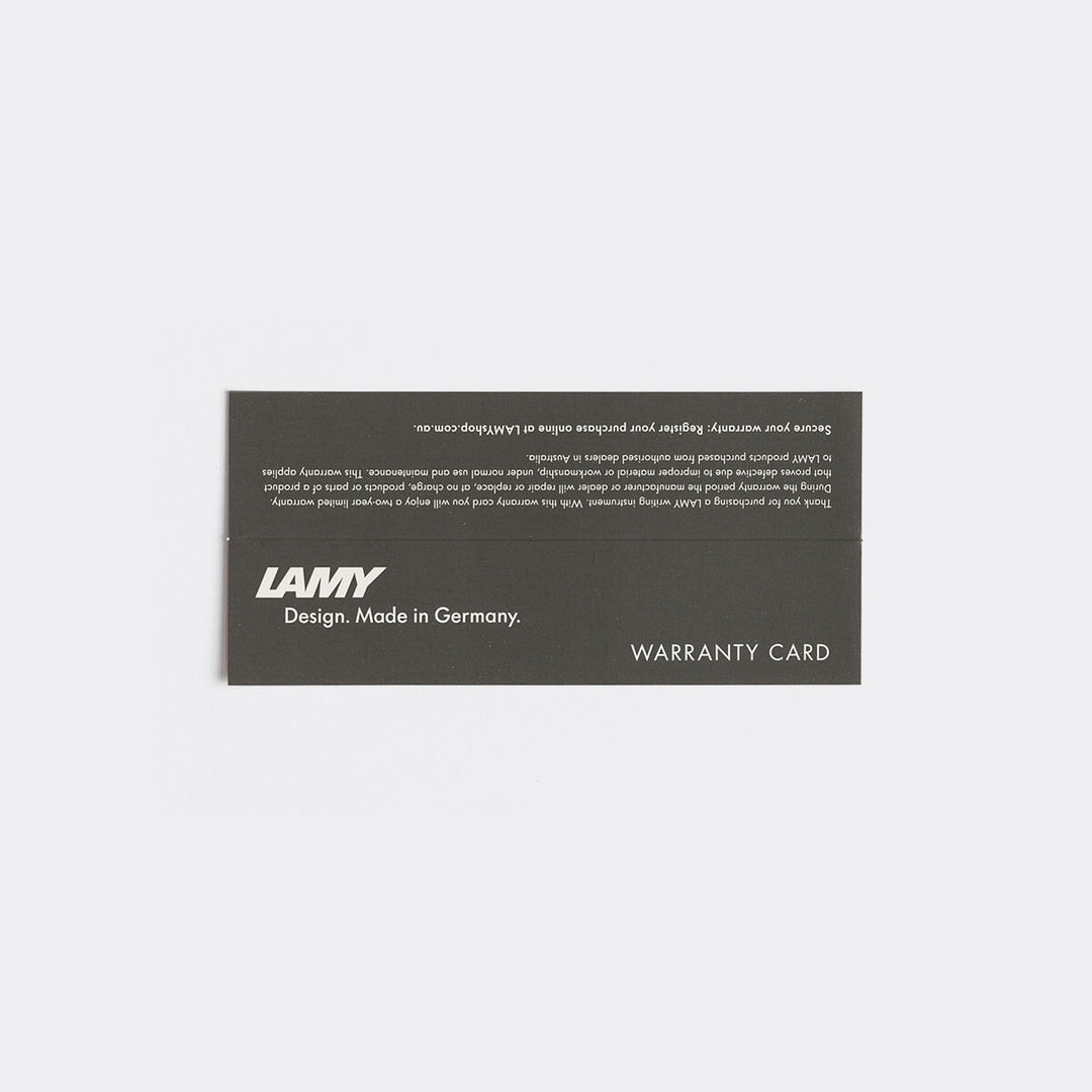 LAMY 2000 - Fine warranty card with LAMY logo, tagline “Design. Made in Germany,” and “WARRANTY CARD” text on dark stock, emphasizing product authenticity.