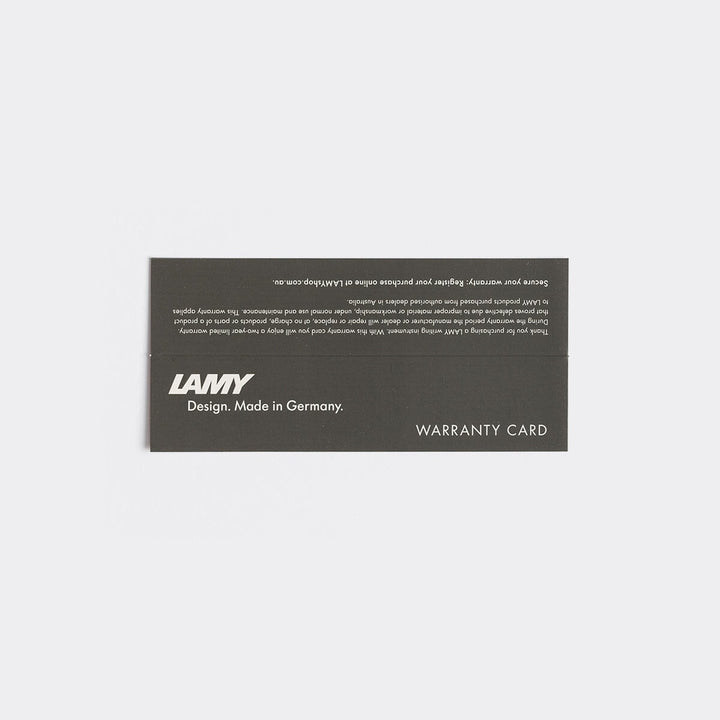 LAMY 2000 - Fine warranty card with LAMY logo, tagline “Design. Made in Germany,” and “WARRANTY CARD” text on dark stock, emphasizing product authenticity.